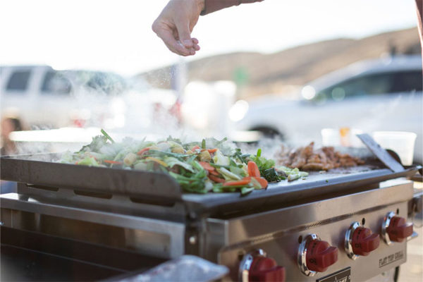 Camp Chef 4-Burner Flat Top 600 Grill and Griddle with Lid Lifestyle